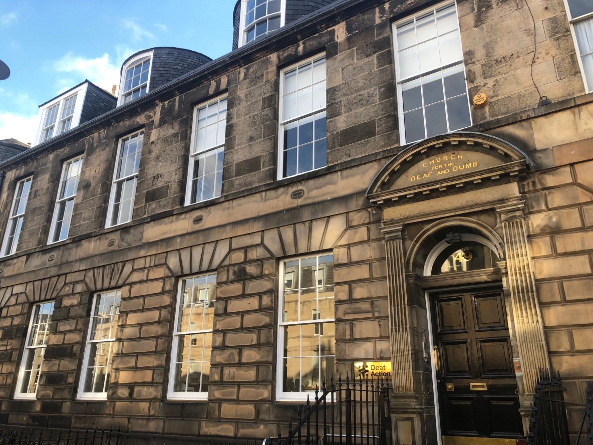 Front of Deaf Action's buidling with black door and Georgian windows